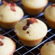 Bacon corn muffins on a cooling rack.