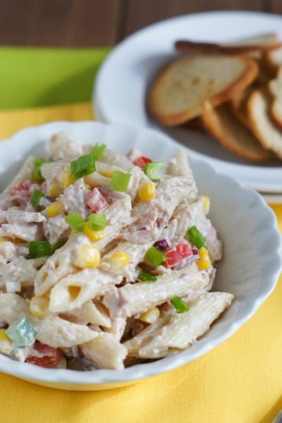 Tuna penne pasta salad served in a white bowl.