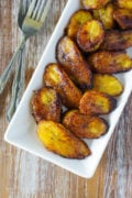 Fried sweet plantains served on a white plate