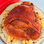 Pineapple chipotle glazed ham on a serving plate.