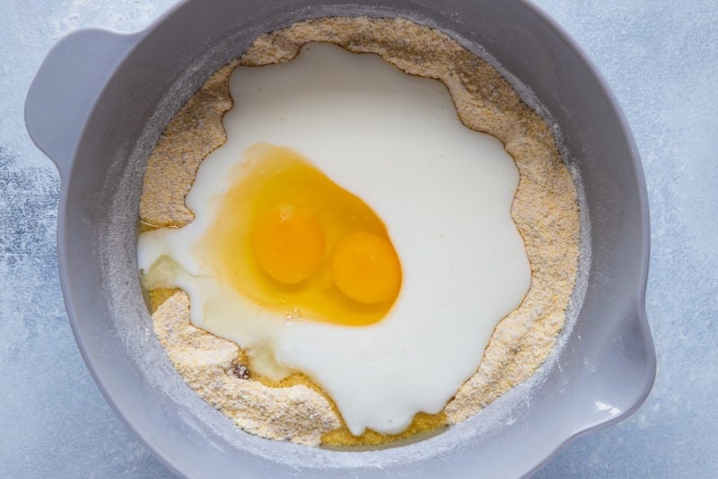 Egg and milk added to the dry ingredients.