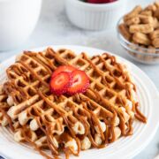 Churro Waffles with Dulce de Leche served on a plate