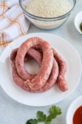 Uncooked Dominican Longaniza on a plate