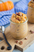 Pumpkin Arroz con Leche topped with chopped pecans