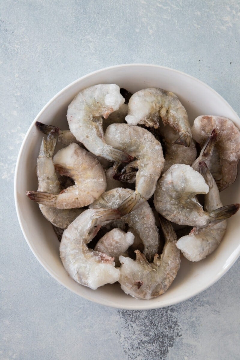jumbo frozen raw shrimp in a bowl