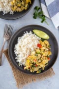 Bacalao con huevos served on a gray plate ready to eat