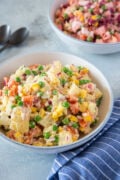 Dominican potato salad in a white bowl