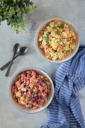 ensalada rusa or mixta (Dominican Potato Salad) in two bowls