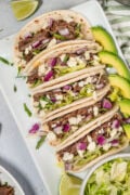 easy barbacoa tacos with avocado on the side