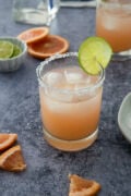 margarita cocktail with grapefruit wedges on the side