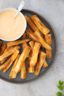 close up yuca fries in a gray plate