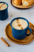 Creamy Dominican hot oatmeal topped with cinnamon in a blue mug.